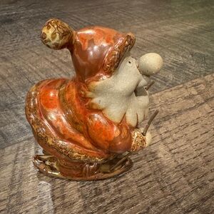 Stoneware Pottery Santa on Skis.